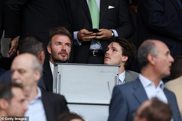 Fun times: The father-and-son enjoyed some quality time together as they soaked up the atmosphere at the Estadio Santiago Bernabeu