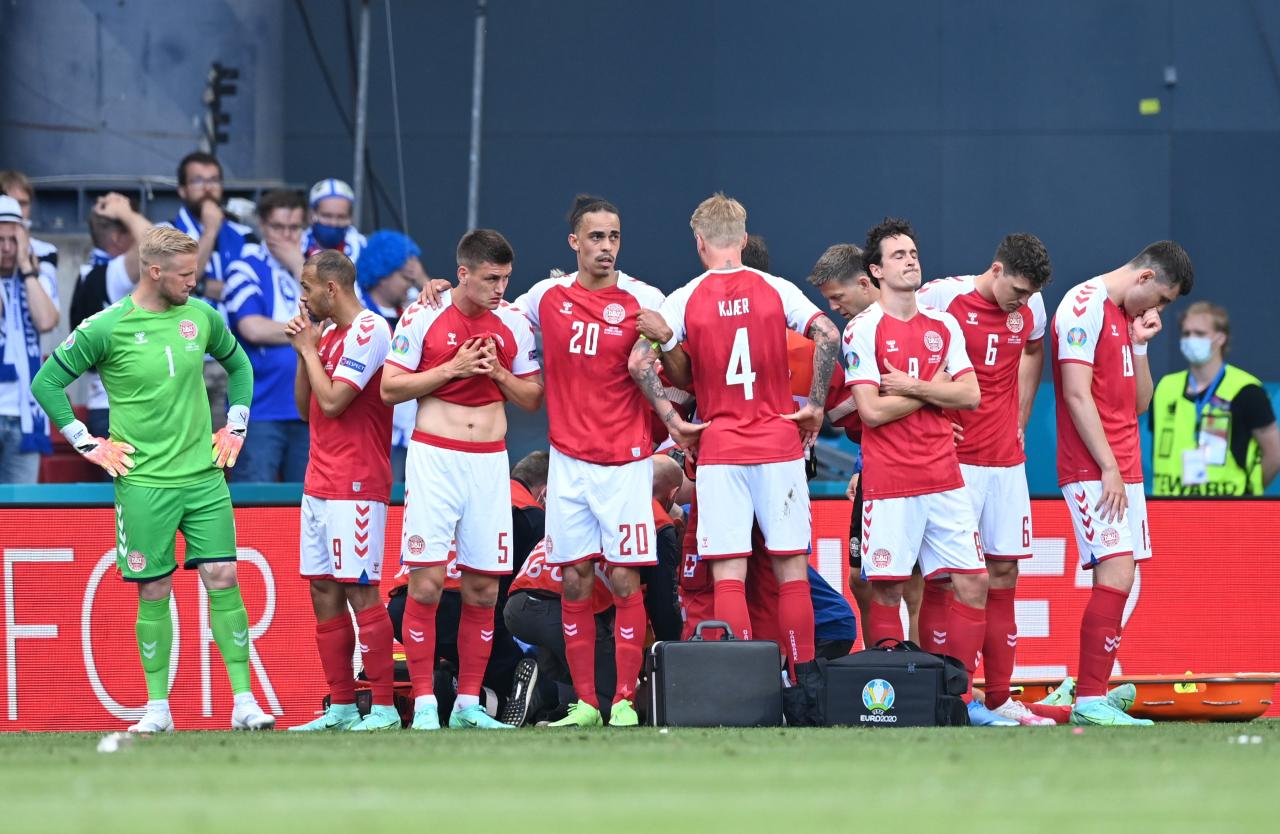 The Denmark team formed a protective circle around Christian Eriksen as he received treatment